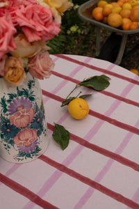 Table covered with a light-colored gingham tablecloth