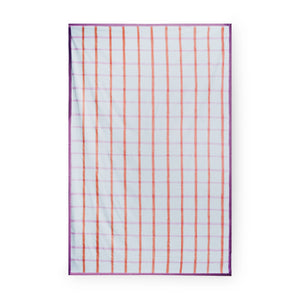 Table cloth with subtle mint green gingham pattern, overlaid with stripes in shades of burnt orange and muted pink, and finished with a deep purple hem. Full product. 